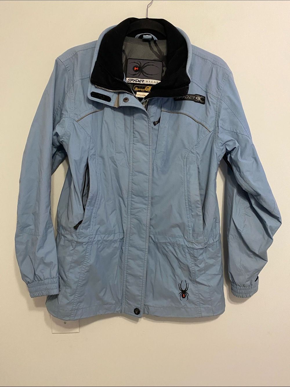Spyder Light Blue Ski Jacket with Black Collar, lots of pockets